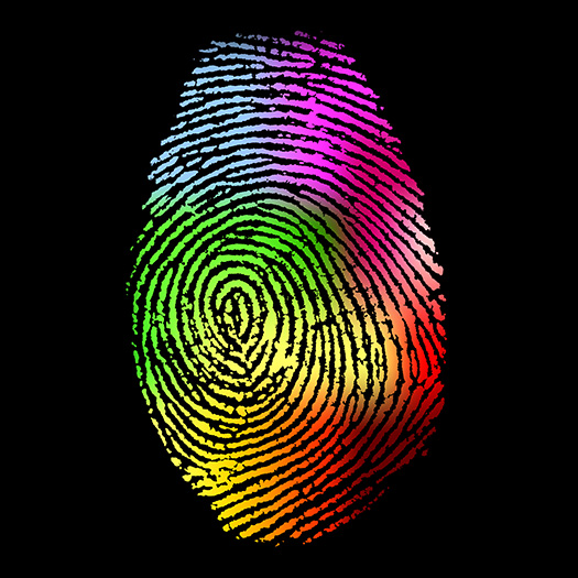 Rainbow swirled fingerprint on black background