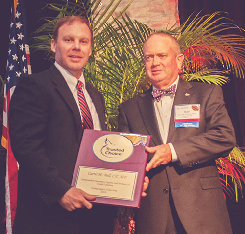 Curtis Bull is the 2014 IIABSC Young Agent of the Year. With IIABSC Chairman of the Board Ken Finch. Award sponsored by AFCO/ Prime Rate Premium Finance.