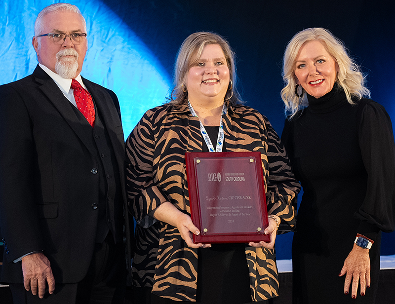 Lynn E. Hudson, CIC, CISR, ACSR, of The Turner Agency Inc (center) is the Hayne P. Glover, Jr. Agent of the Year