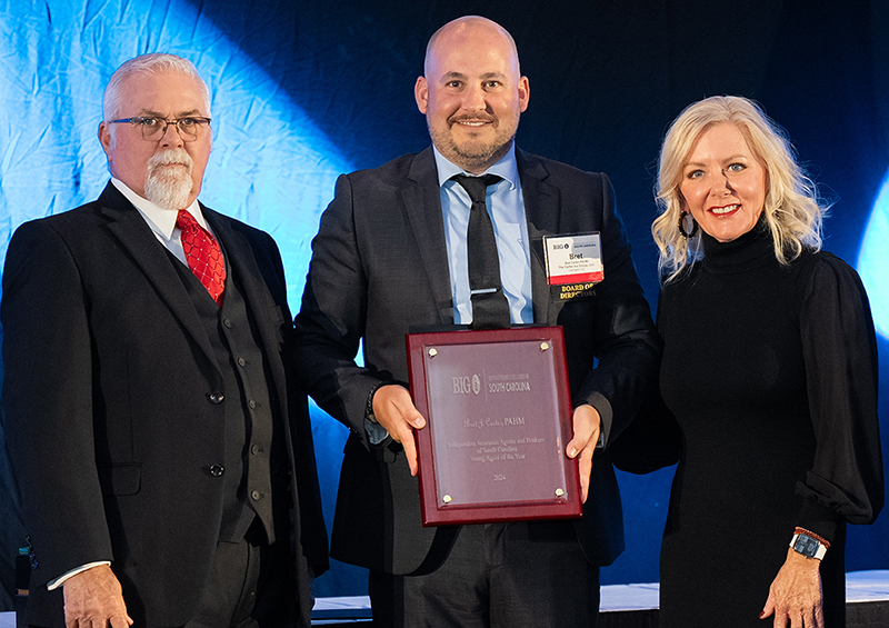 Bret Carter, PAHM, (center) of Carter Insurance Group has been named the 2024 IIABSC Young Agent of the Year