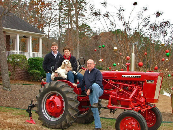 New Chairman of the Board Ken Finch with his family outside their home.