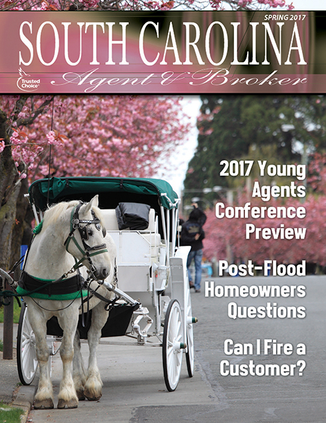 Cover of the Spring edition of SC Agent & Broker magazine features a white horse pulling a carriage of tourists among the cherry blossoms in Charleston, SC.