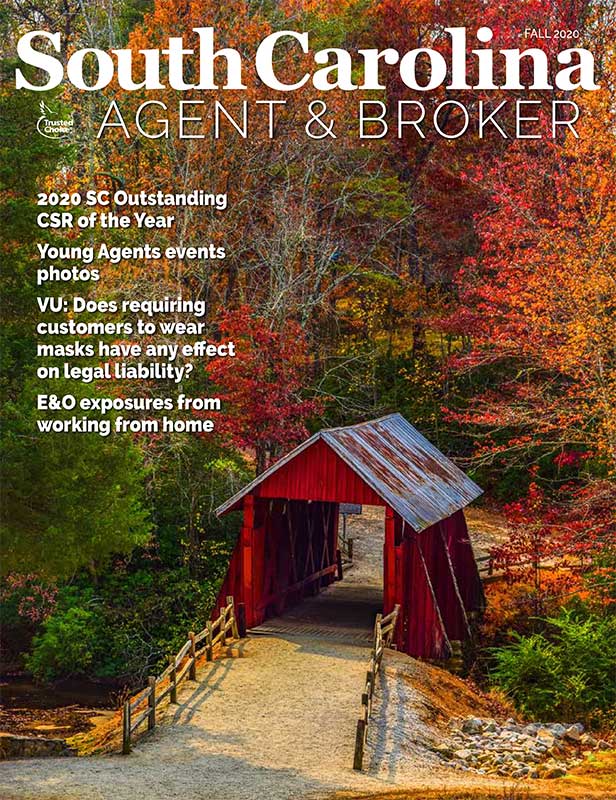 Cover features fall leaves at Cambells Covered Bridge, a red wooden structure in Landrum, only remaining covered bridge in SC.